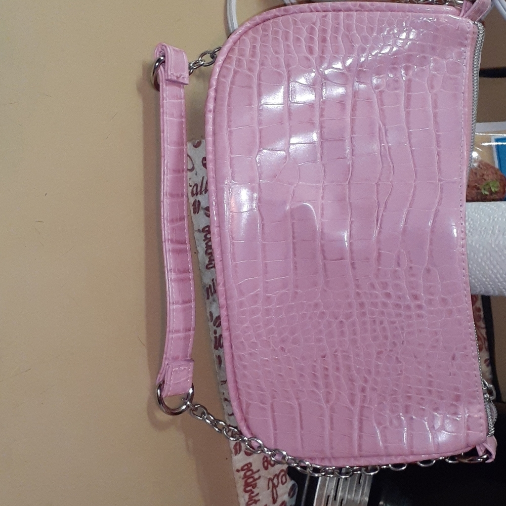 Pink purse, it fun and colorful.